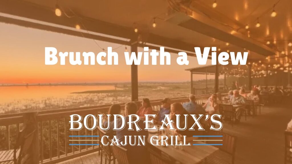 Outdoor dining patio overlooking Mobile Bay at Boudreaux’s Cajun Grill in Daphne AL during Sunday brunch.