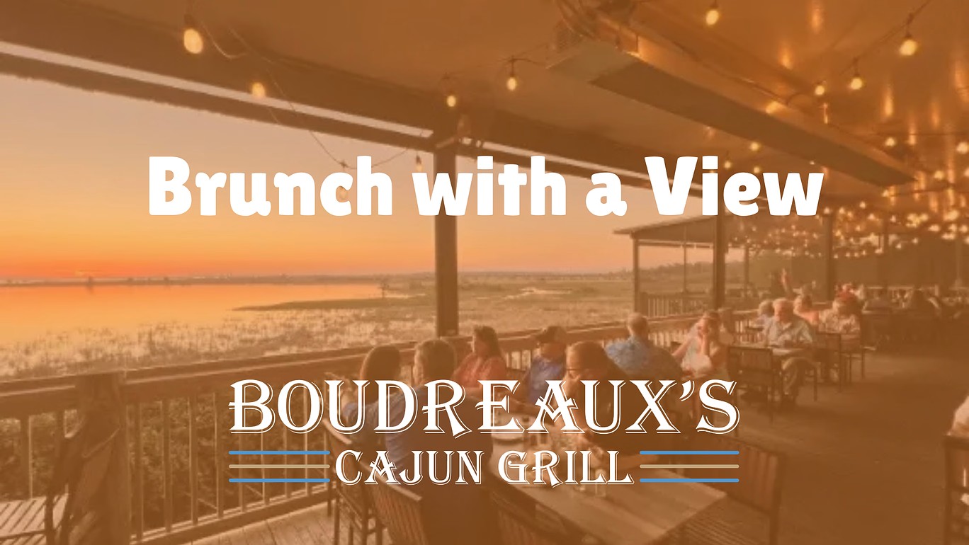 Outdoor dining patio overlooking Mobile Bay at Boudreaux’s Cajun Grill in Daphne AL during Sunday brunch.